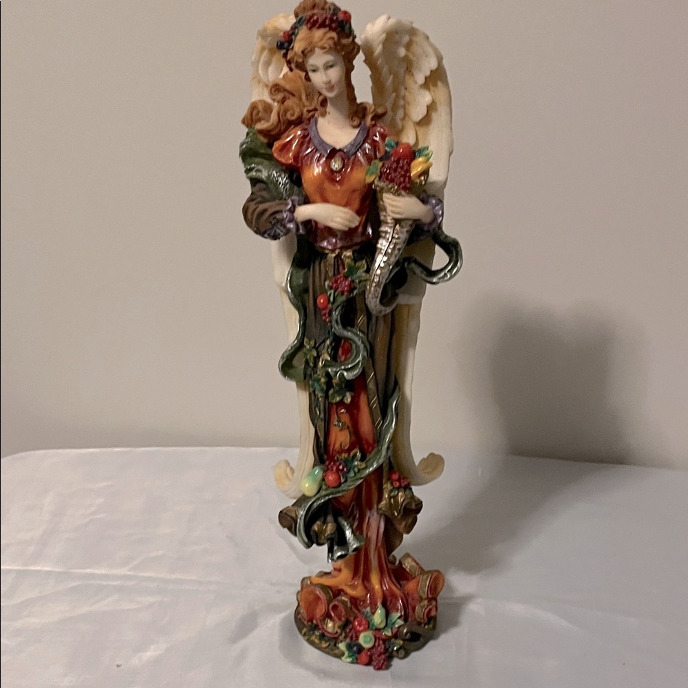 Elegant Angel Figurine with Floral Accents